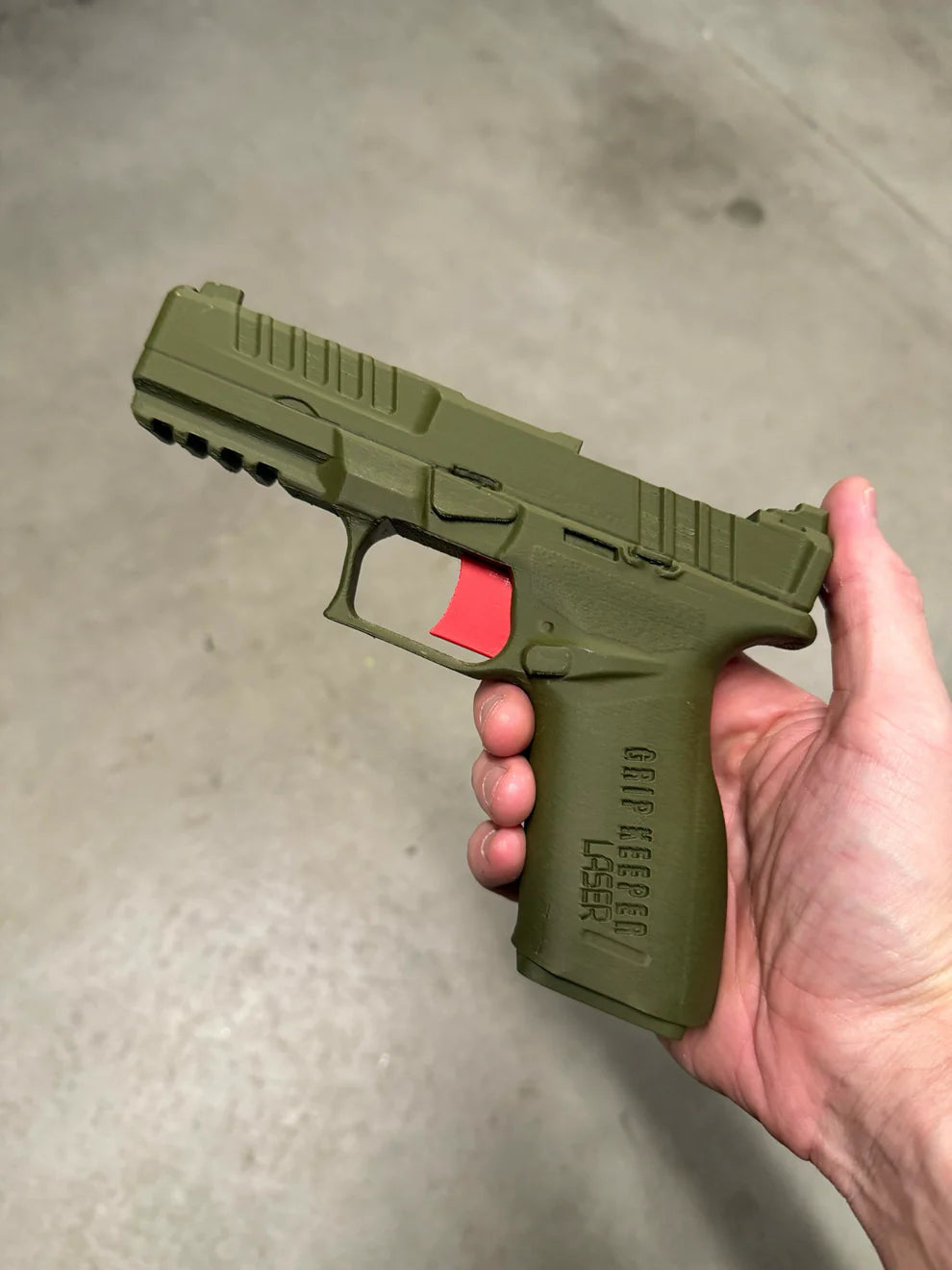 Grip Keeper Laser Trainer – Trigger-Activated Laser Training Pistol