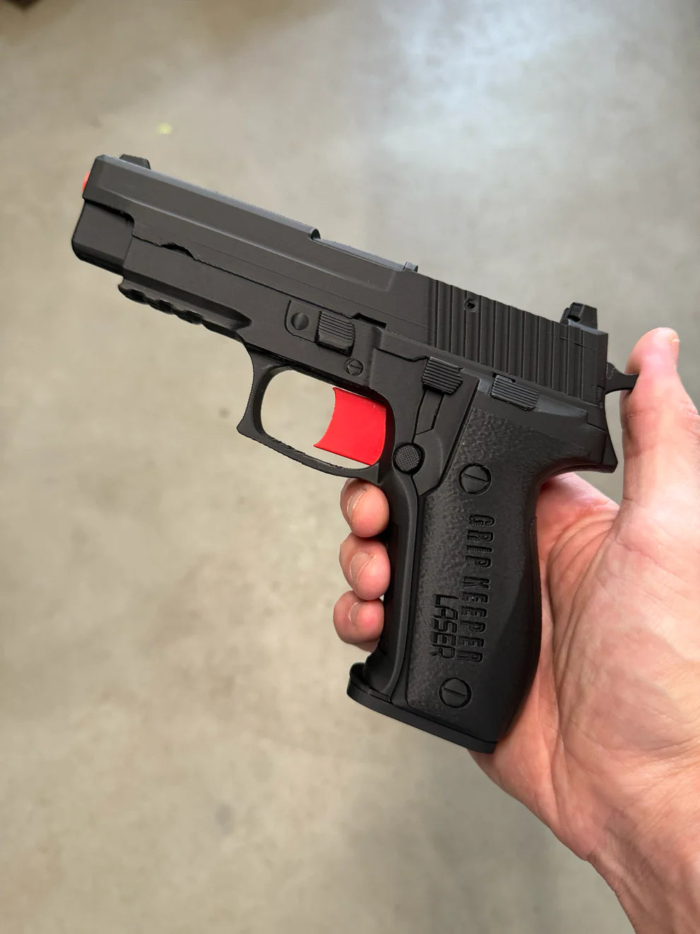 Grip Keeper Laser Trainer – Trigger-Activated Laser Training Pistol